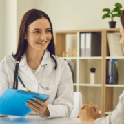 British expat couple consulting an English-speaking doctor in a Marbella private clinic.