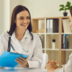 British expat couple consulting an English-speaking doctor in a Marbella private clinic.