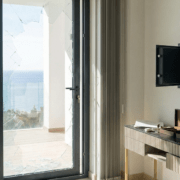 Smashed glass door and empty safe after a burglary in a luxury Costa del Sol apartment, highlighting the need for private contents insurance.