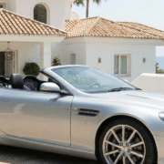 British expat standing next to a luxury car after securing premium car insurance in Marbella
