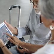British retired couple arriving at Malaga airport for their Non-Lucrative Visa residency on the Costa del Sol.