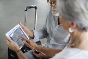 British retired couple arriving at Malaga airport for their Non-Lucrative Visa residency on the Costa del Sol.