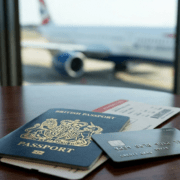 Passport and boarding pass on a lounge table representing annual multi-trip insurance for frequent flyers in Malaga.