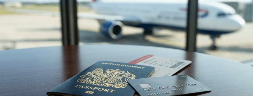 Passport and boarding pass on a lounge table representing annual multi-trip insurance for frequent flyers in Malaga.