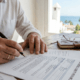 Expat professional signing a business liability insurance contract in Fuengirola.