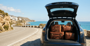 Leather luggage in a car boot illustrating seamless travel protection for Costa del Sol expats. generame eseo