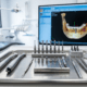 Modern dental implant tools and 3D jaw scan in a Spanish clinic.