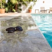 Slippery wet tiles next to a swimming pool in a Spanish villa.