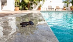 Slippery wet tiles next to a swimming pool in a Spanish villa.