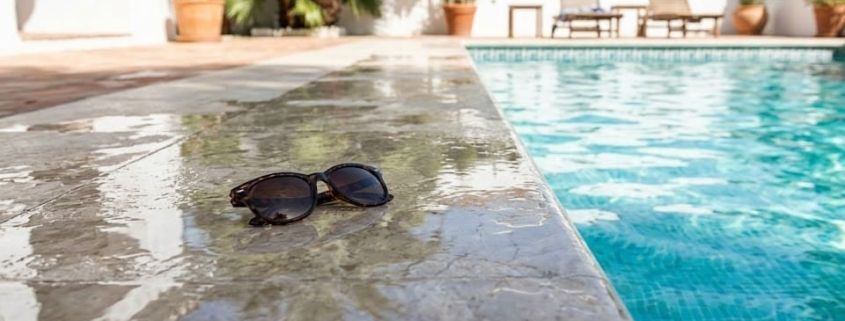 Slippery wet tiles next to a swimming pool in a Spanish villa.