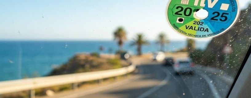 Spanish ITV sticker on a car windshield in Andalucia.